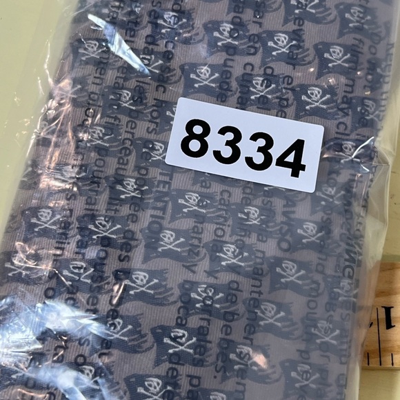 Official Disney Pirates of the Carribean Brown Tie with Skull Flag Pattern - Picture 7 of 7